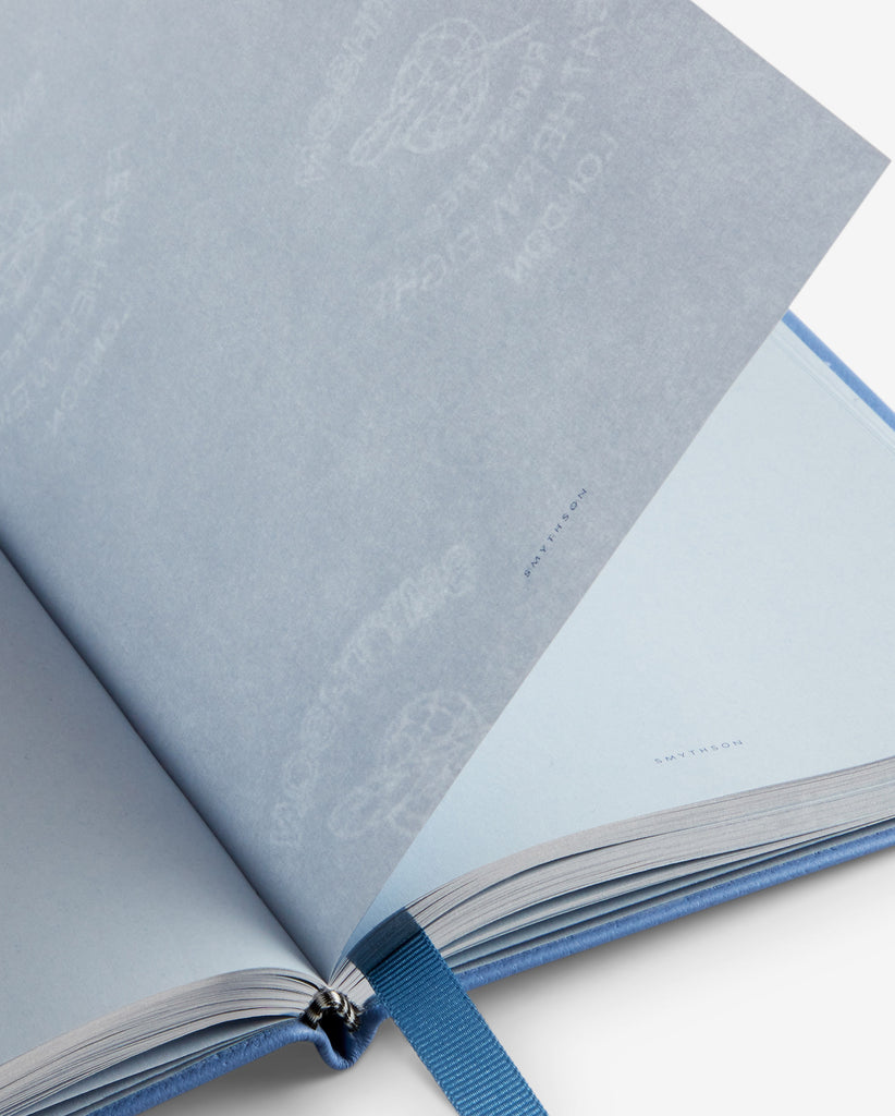 Close-up of Smythson’s pale blue Featherweight Paper inside a notebook